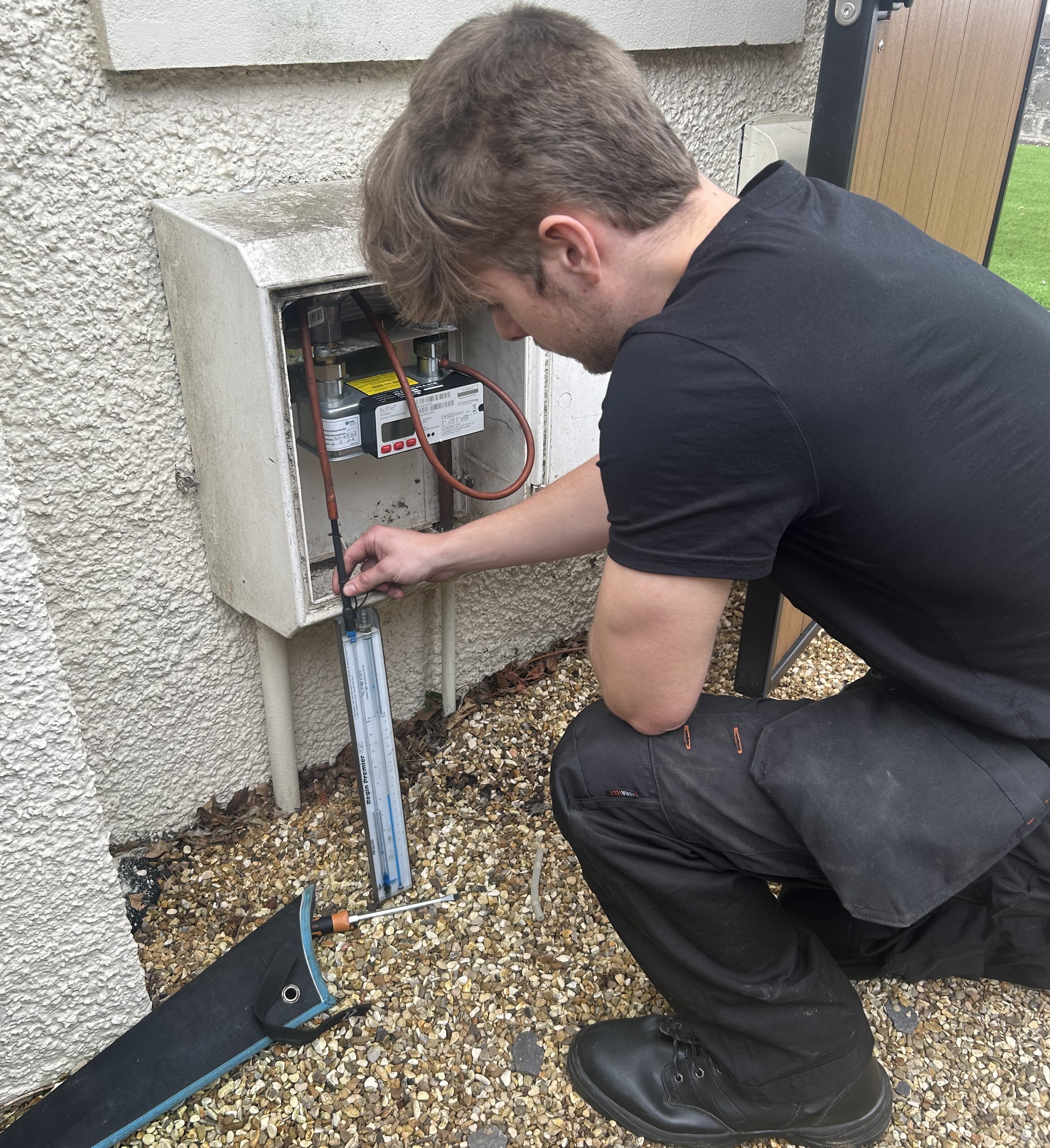Gas engineer testing for gas leaks and carrying out a safety inspection in Chester