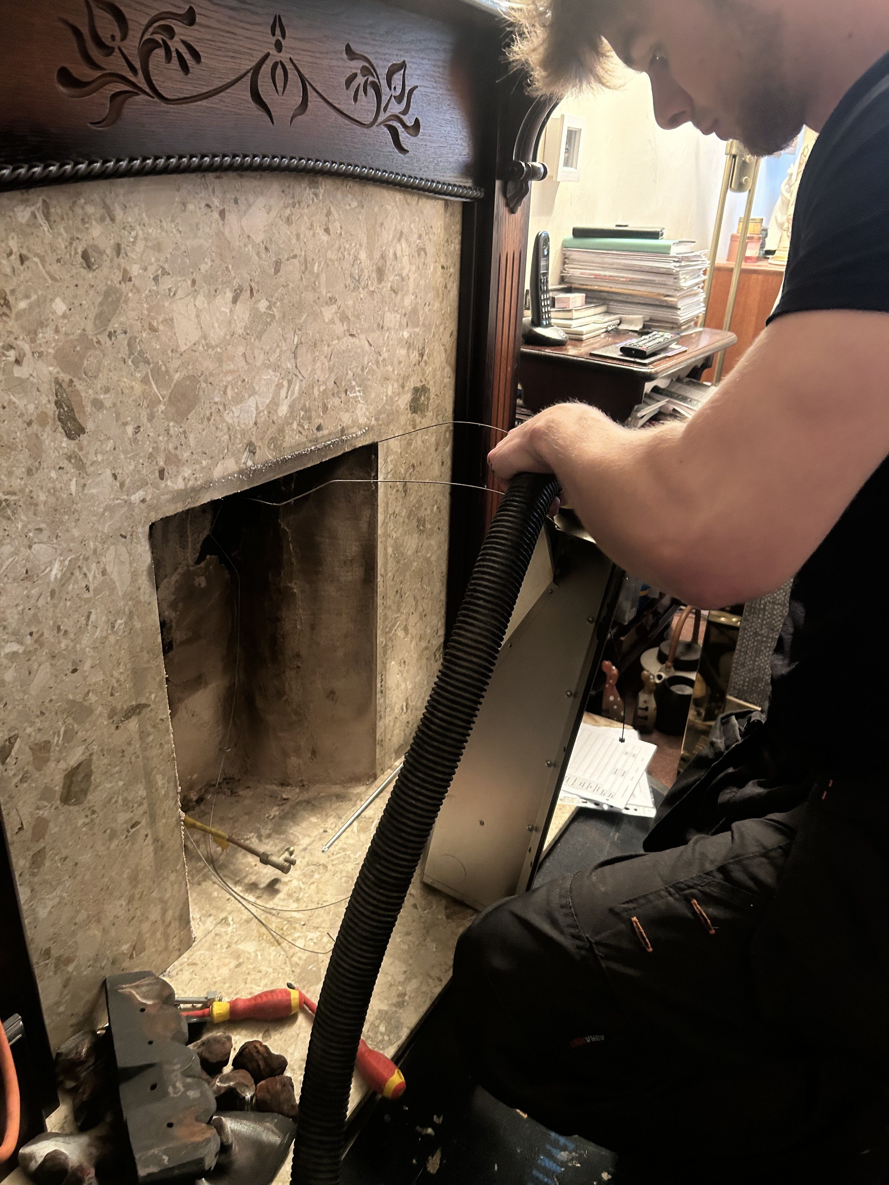 Gas engineer carrying out a gas fire service in Chester