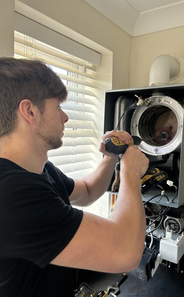 Gas engineer carrying out a Viessmann boiler service in Chester